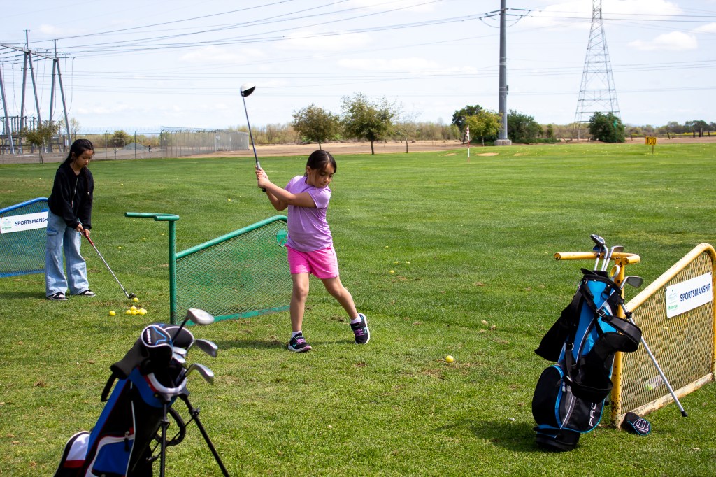 Junior golfer practice First Tee